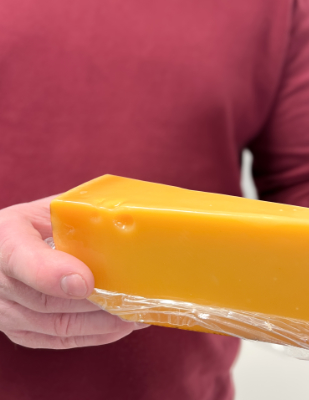 Piece of cheese in shrink wrap